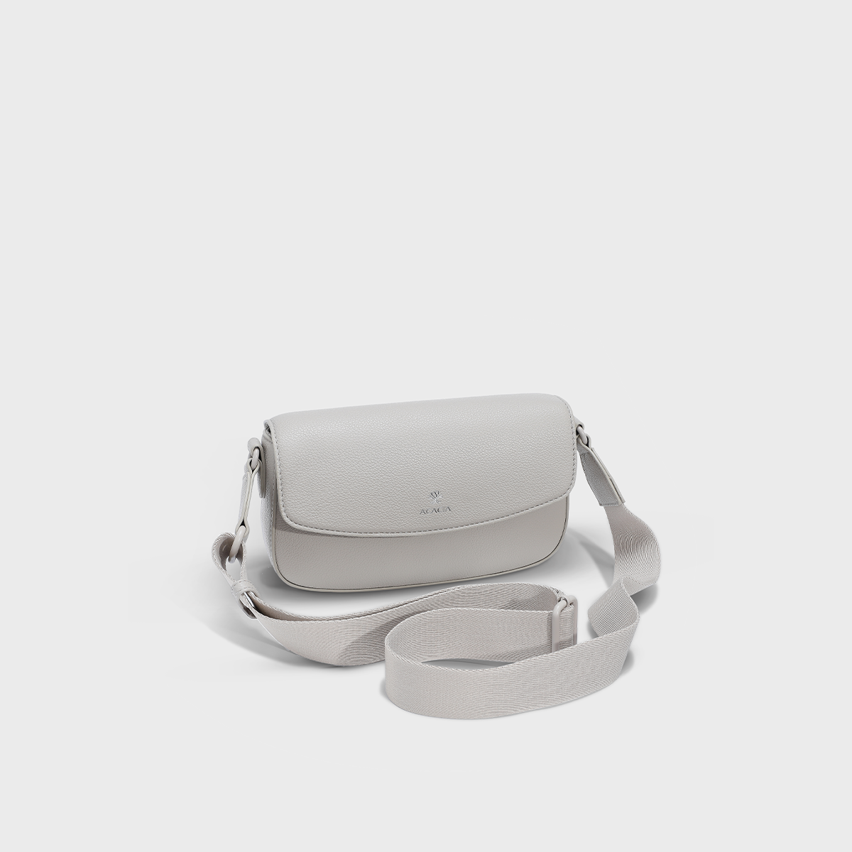 Front view of the ACACIA IVY in Moonstruck, a premium unisex crossbody sling bag designed for both women and men. Features a magnetic front flap, hidden zipper closure for double security, soft vegan PU leather, and wide adjustable strap. A sleek everyday sling bag perfect for urban style and hands-free comfort.