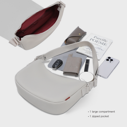 Interior capacity of the ACACIA Clover belt bag. Premium PU leather, burgundy lining, charm loop, and spacious compartments. A Uniqlo-style minimalist fanny pack for women.