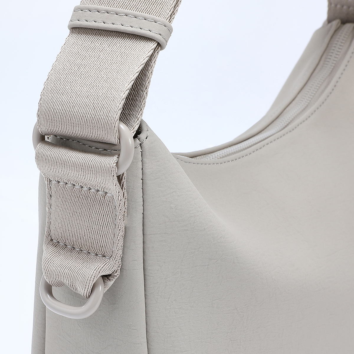 Detailed close-up of ACACIA Clover strap and hardware. Premium PU leather, reinforced stitching, color-matched metalwork, and charm loop. Perfect Uniqlo-style minimalist belt bag for women.