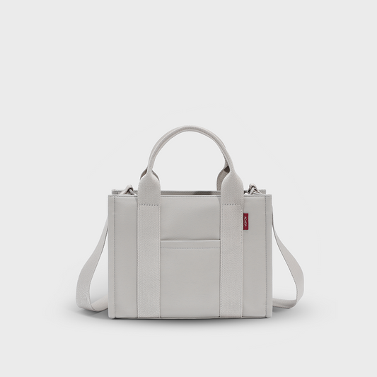 ACACIA Fern Mini Tote Bag in premium leather-feel PU, structured silhouette, water-repellent finish, and minimalist design. Compact but fits 11-inch tablet, with crossbody strap, burgundy lining, and color-matched hardware. Urban Uniqlo-style small tote.