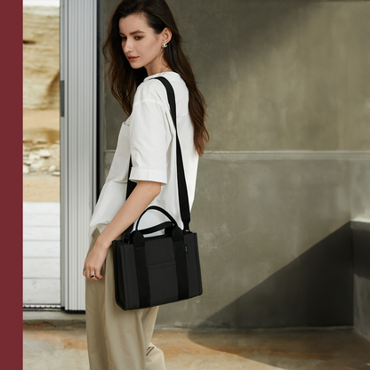 ACACIA Fern Mini Tote worn crossbody. Premium PU leather feel, structured body, and compact design that holds an 11-inch notepad. Minimalist urban tote for work, commuting, and daily wear.