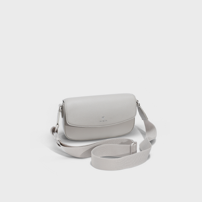 Front view of the ACACIA IVY in Moonstruck, a premium unisex crossbody sling bag designed for both women and men. Features a magnetic front flap, hidden zipper closure for double security, soft vegan PU leather, and wide adjustable strap. A sleek everyday sling bag perfect for urban style and hands-free comfort.