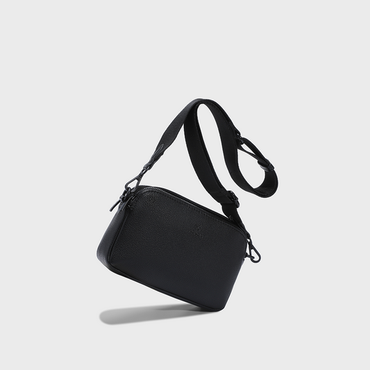 Premium soft vegan leather unisex crossbody bag featuring wide adjustable strap, double-zip compartments, compact travel-ready design, and minimalist silhouette. ACACIA Moss sling bag for daily carry, urban commuting, and hands-free comfort.