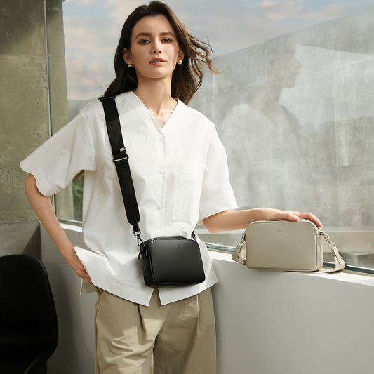 ACACIA Moss crossbody bag worn as a minimalist unisex sling. Soft vegan leather, wide strap, and double-zip storage for everyday urban comfort.