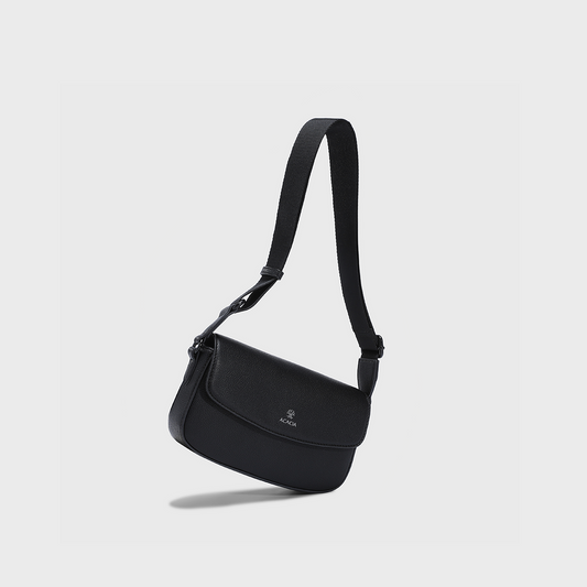 The ACACIA IVY unisex crossbody sling bag in premium vegan PU leather featuring a magnetic front flap and hidden zipper for double security. A minimalist sling bag for men and women, ideal for travel, daily carry, and hands-free urban style.