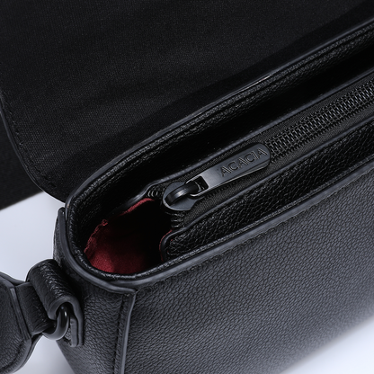 Detail shot of the IVY unisex crossbody bag highlighting the secure hidden zipper, burgundy lining, and premium vegan leather. A safe, stylish sling bag for men and women.