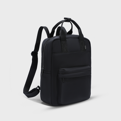 Front view of the ACACIA Reed Backpack in Moonstruck beige. A unisex compact backpack designed for students and young adults, featuring lightweight water-repellent nylon, premium metal hardware, and space for a 14-inch laptop. Perfect for daily commuting and urban lifestyles.