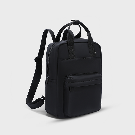 Front view of the ACACIA Reed Backpack in Moonstruck beige. A unisex compact backpack designed for students and young adults, featuring lightweight water-repellent nylon, premium metal hardware, and space for a 14-inch laptop. Perfect for daily commuting and urban lifestyles.