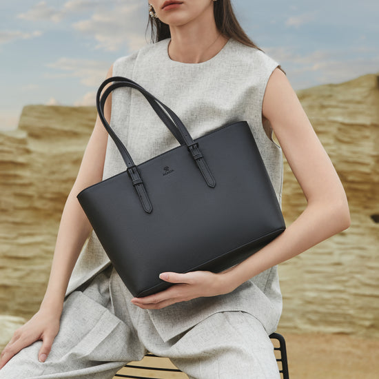 Video showcase of the ACACIA Cedar tote bag, featuring its minimalist Japanese design, rigid and waterproof PU leather, anti-scratch texture, and spacious capacity. The Cedar tote easily fits A4 documents, notebooks and an 11-inch laptop, making it the perfect everyday work bag for office women and professionals. Close-up shots highlight the structured shape, matching metal hardware, reinforced handles and clean essential design created in Japan.