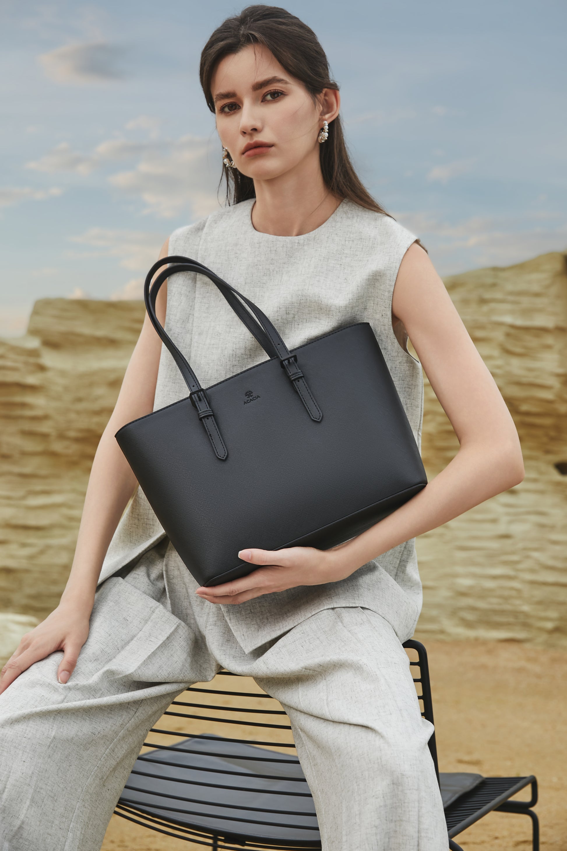 Video showcase of the ACACIA Cedar tote bag, featuring its minimalist Japanese design, rigid and waterproof PU leather, anti-scratch texture, and spacious capacity. The Cedar tote easily fits A4 documents, notebooks and an 11-inch laptop, making it the perfect everyday work bag for office women and professionals. Close-up shots highlight the structured shape, matching metal hardware, reinforced handles and clean essential design created in Japan.